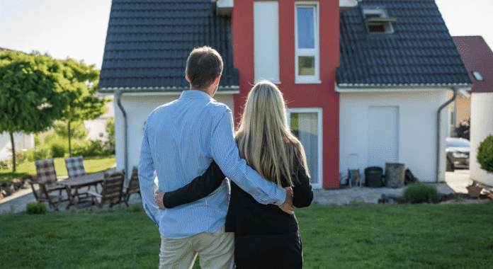 A couple looking at their new home with Paladin Realty.